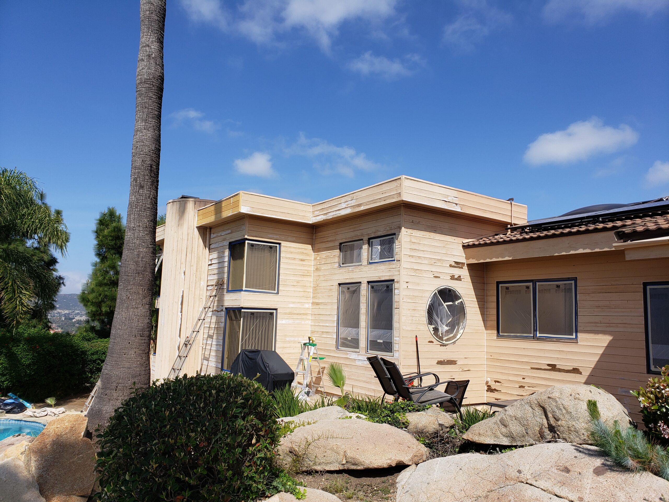 House in the process of being prepped to be painted