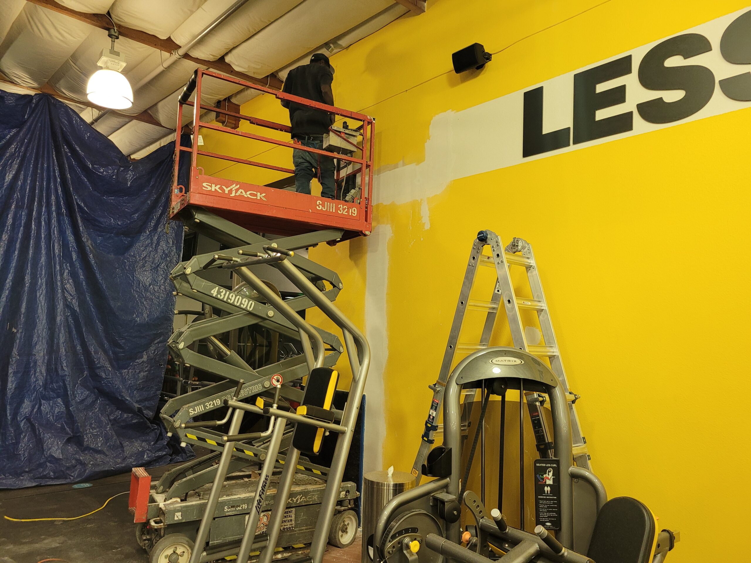 Wall being painted in a gym